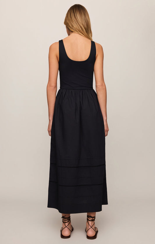 A timeless cotton poplin midi dress featuring a flattering scoop neckline, wide straps, and effortless comfort with a polished everyday silhouette.