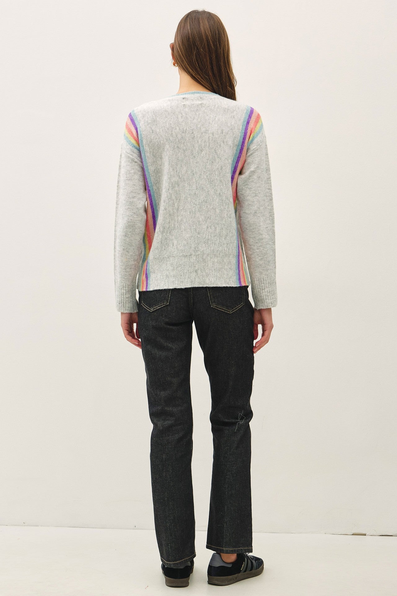 lightweight striped wool blend sweater featuring a soft hand feel, relaxed fit, and vertical rainbow design.