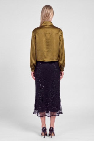 A lustrous satin blouse with a subtle zebra pattern, elegant bow-tie neckline, and relaxed cropped silhouette for a sophisticated statement look.