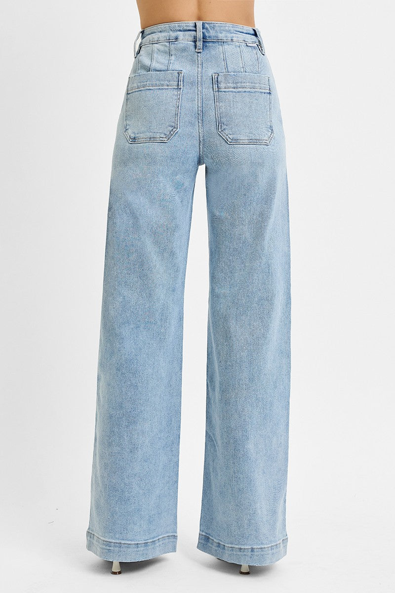 Classic denim meets modern style in these high-rise wide-leg jeans featuring flattering slanted front pockets and an effortlessly chic silhouette.