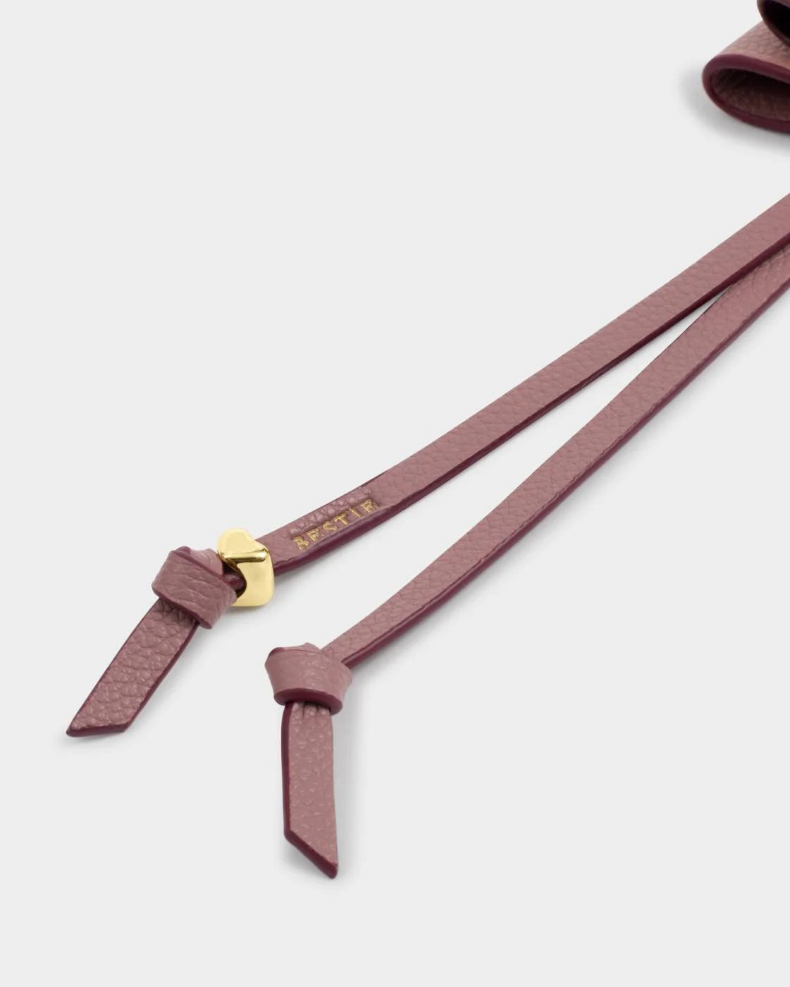 Our Bow Charm Keyring in Black Cherry features a sweet bow-shaped design, stamped with the sweet sentiment ‘Bestie’. Finished with gold-tone signature charm detailing, it makes the perfect gift for someone special.

