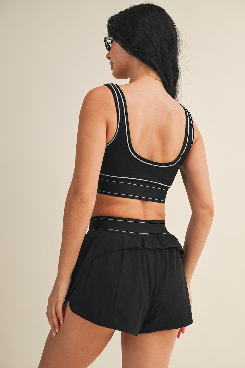 A sleek and supportive performance sports bra featuring eye-catching contrast stitching, breathable stretch, and a smooth, comfortable feel.