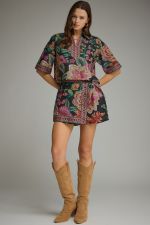 A feminine botanical print two-piece set featuring a breezy split-V top and wrap-front skort for effortless warm-weather style.