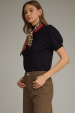 The Beatrice Knit Top adds a chic twist to everyday style with feminine puff sleeves and a versatile detachable scarf neckline detail.