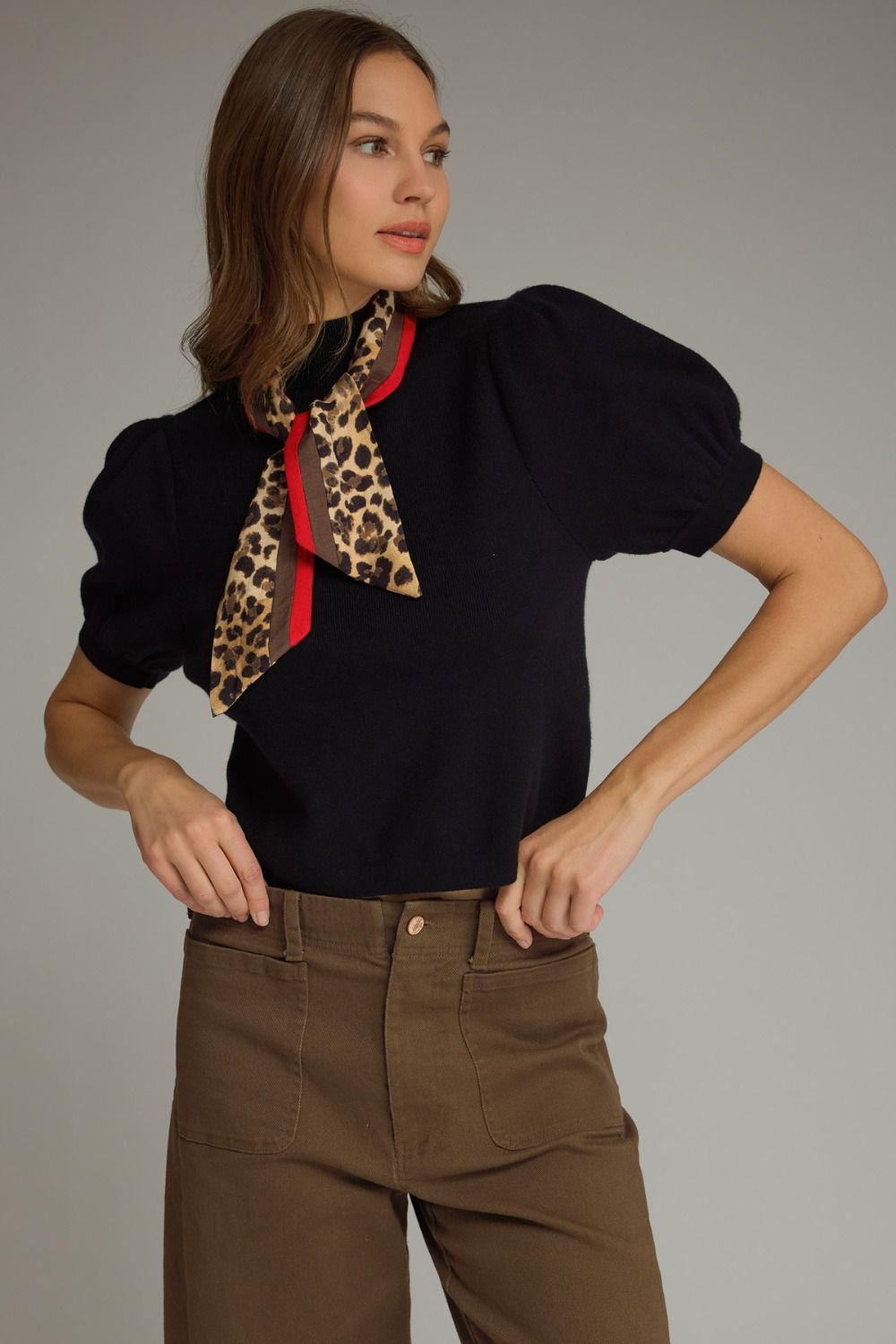 The Beatrice Knit Top adds a chic twist to everyday style with feminine puff sleeves and a versatile detachable scarf neckline detail.