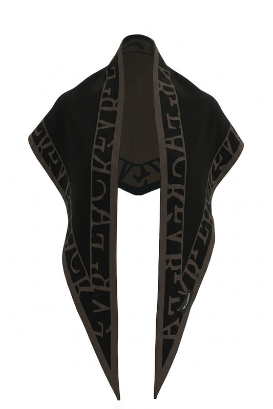 A cozy knit triangle scarf featuring reversible color blocking and stylish lettering details for a versatile cold-weather accessory.

