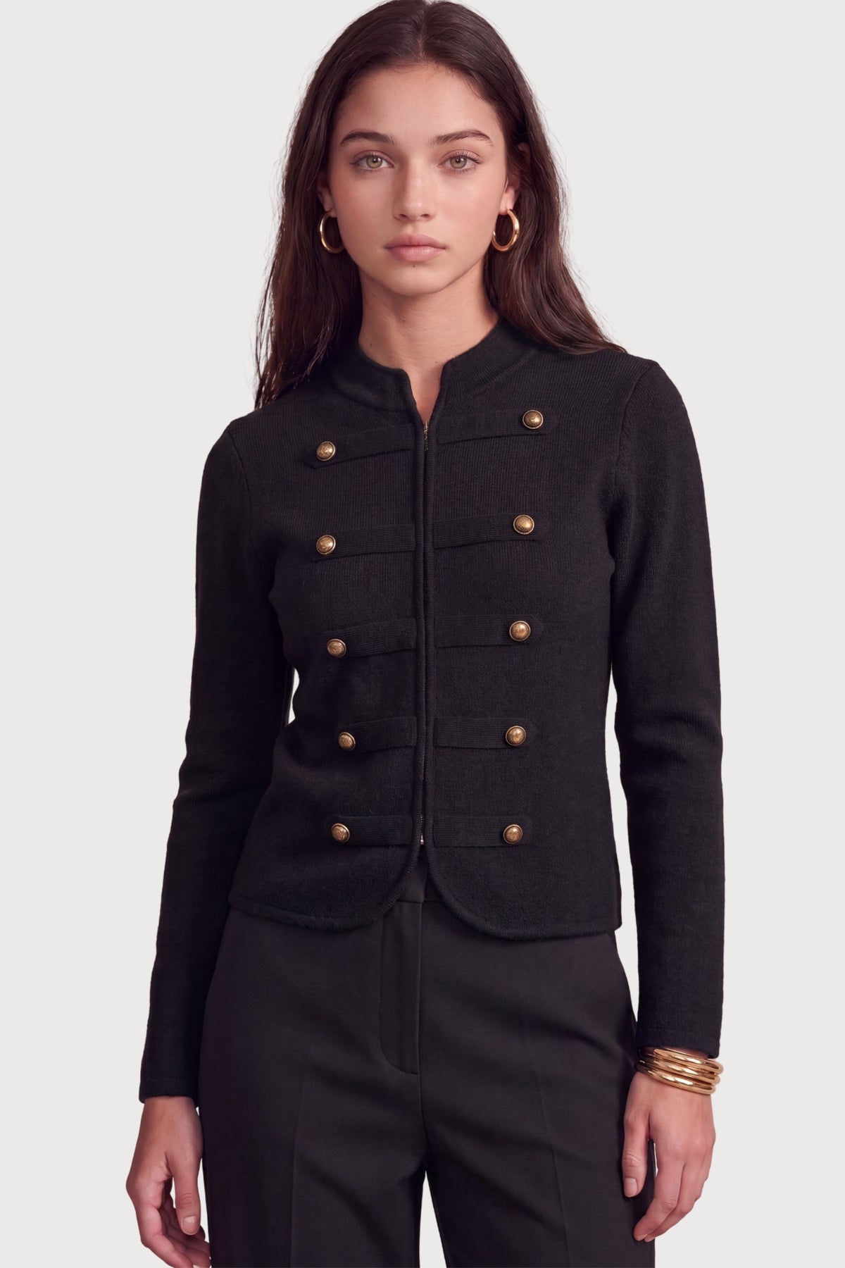 A polished military-inspired knit jacket featuring a structured silhouette, collarless crew neckline, and statement dome buttons for a timeless, tailored look.