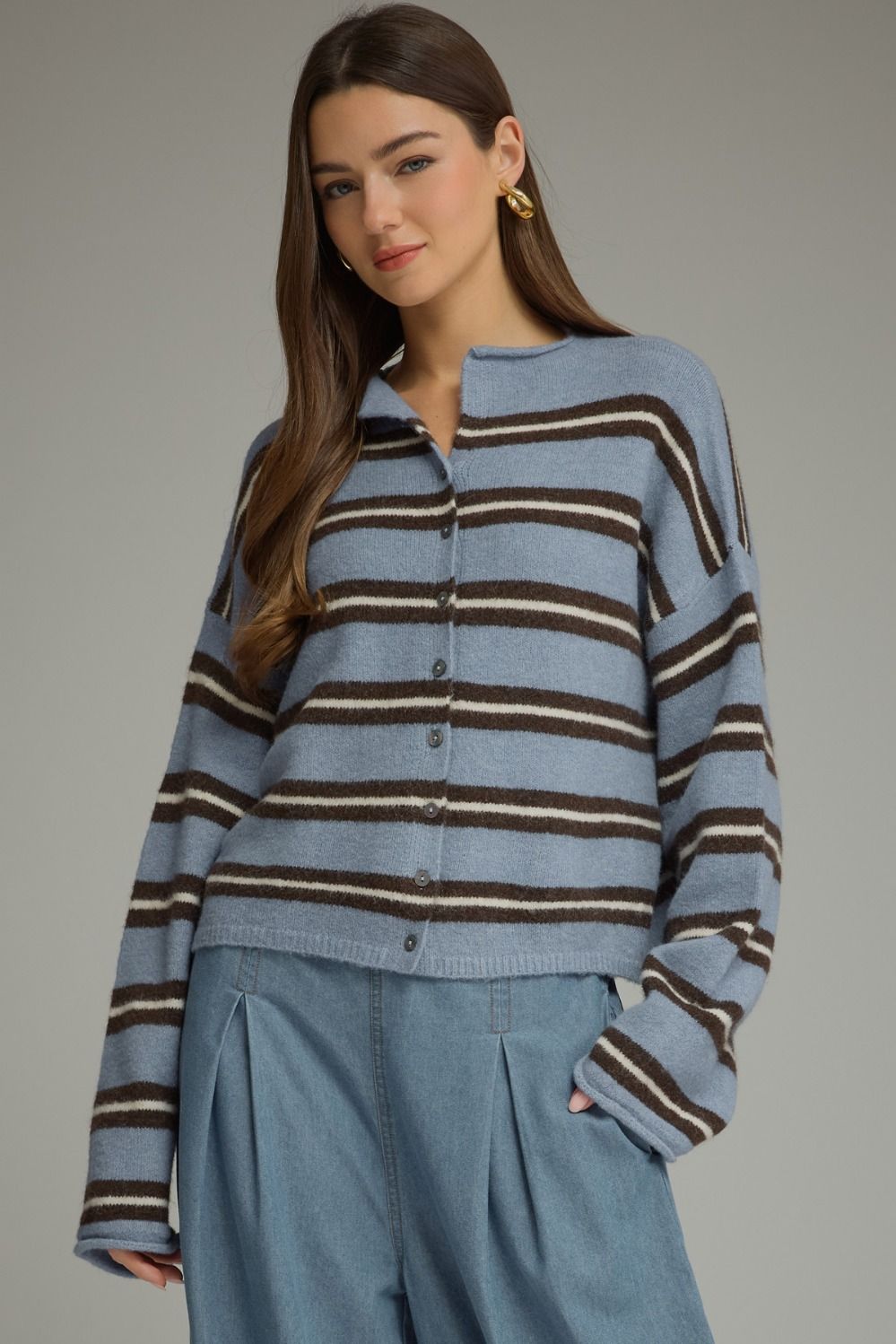 A cozy-chic striped cardigan featuring a classic shirt collar, button-front closure, and soft fuzzy texture for an effortlessly elevated seasonal layer.