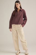 A lightweight polka dot jacket featuring a collared neckline, zip-front closure, and elastic hem for effortless everyday layering.
