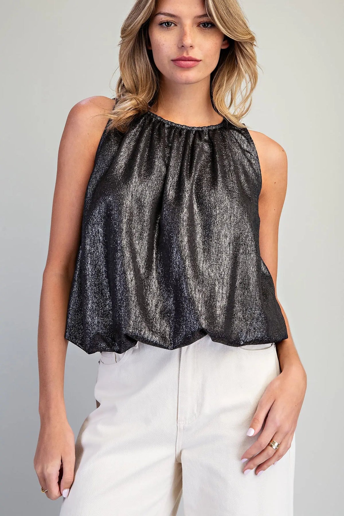 Add a touch of modern elegance to any outfit with this shimmery bubble hem tank top featuring a gathered neckline and sophisticated back keyhole detail.