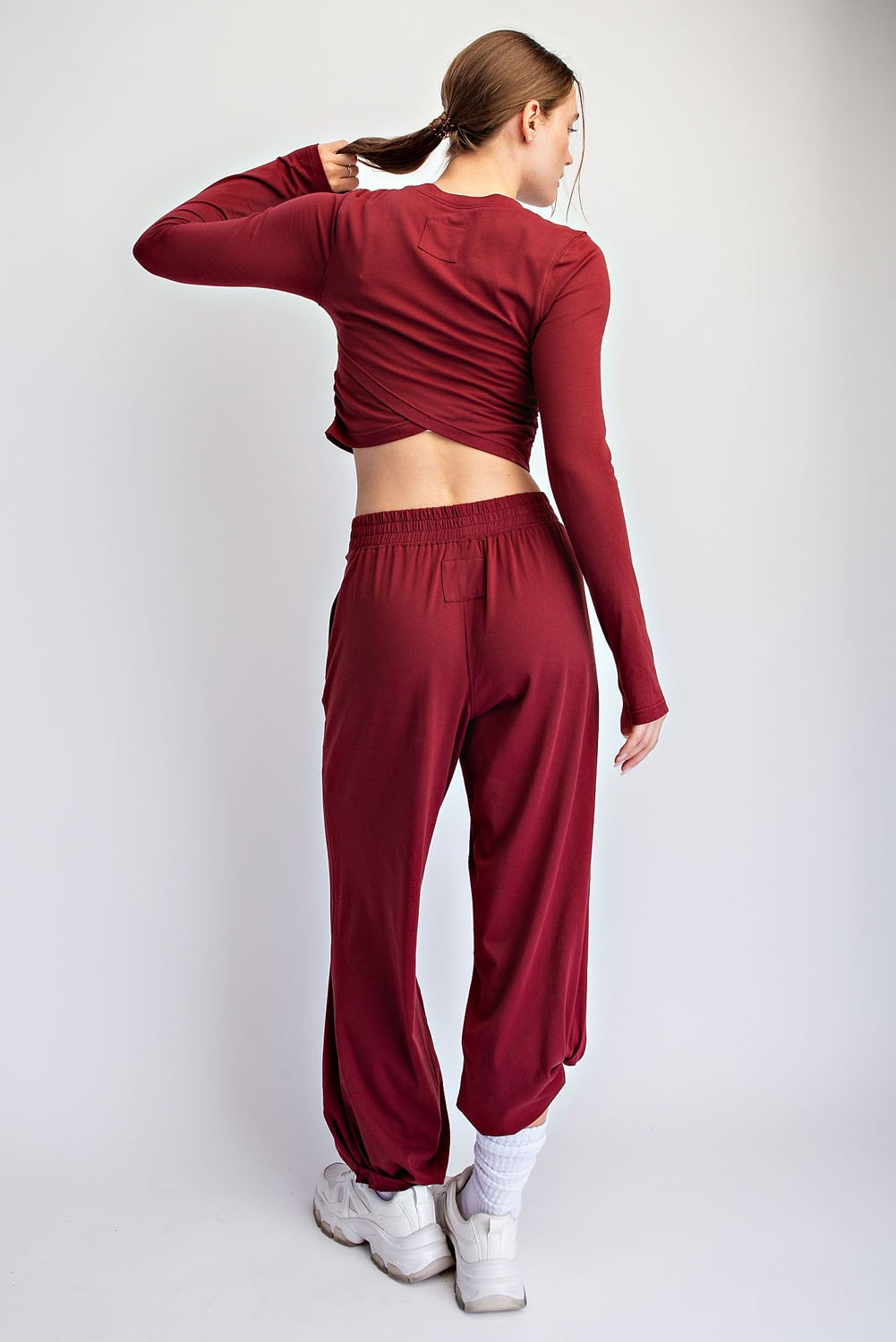 A soft, breathable cotton Lycra two-piece set featuring a cropped long sleeve top and relaxed ankle-length pants for effortless comfort from active days to downtime.

