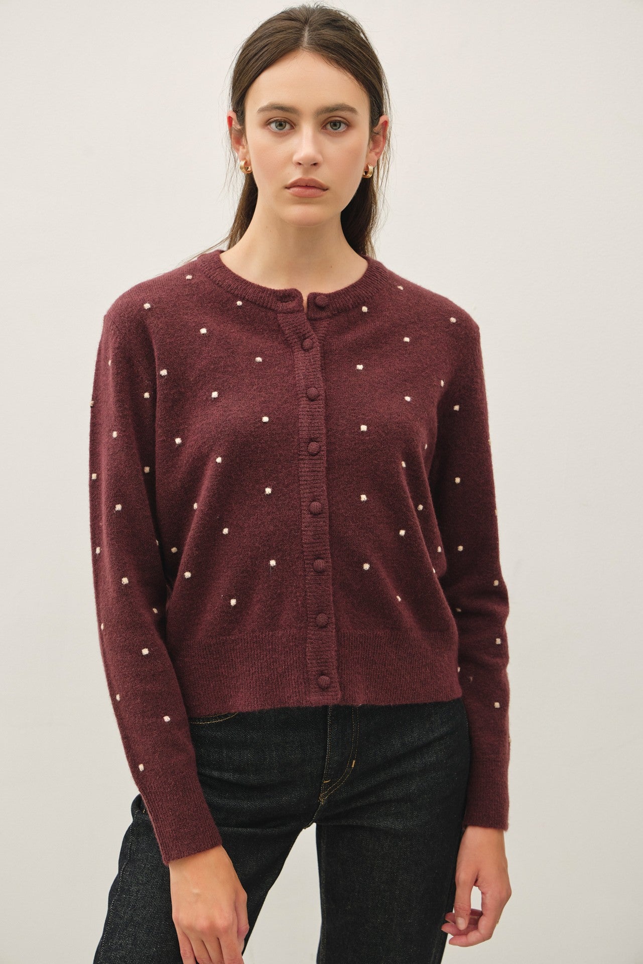 burgundy knit cardigan with small white embroidered dots and button-front closure, crew neckline,