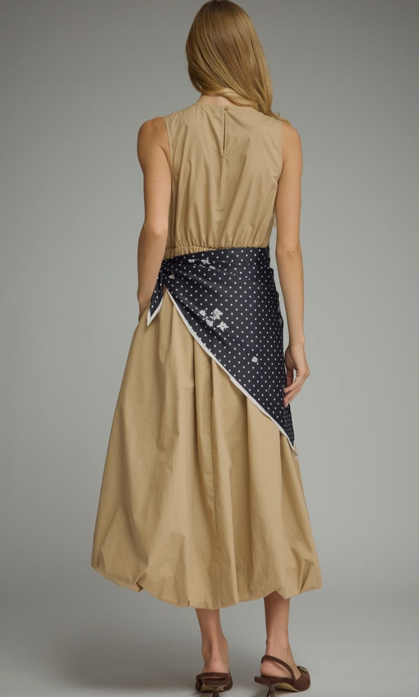 Effortlessly elegant and undeniably unique, the Sable Scarf Dress blends modern sophistication with artistic detail for a statement look you'll love.