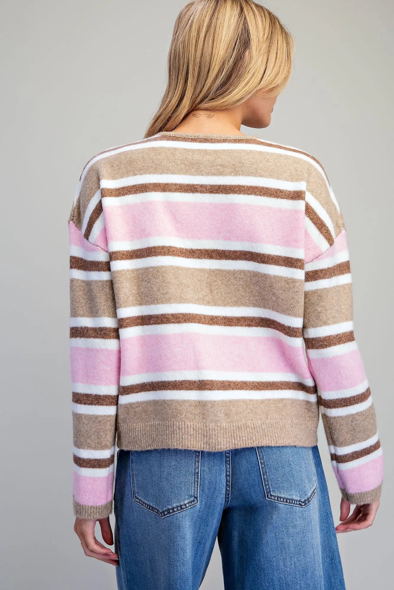 A timeless striped cardigan with a classic button-front design, relaxed dropped shoulders, and subtle ribbed trim for effortless everyday layering.

