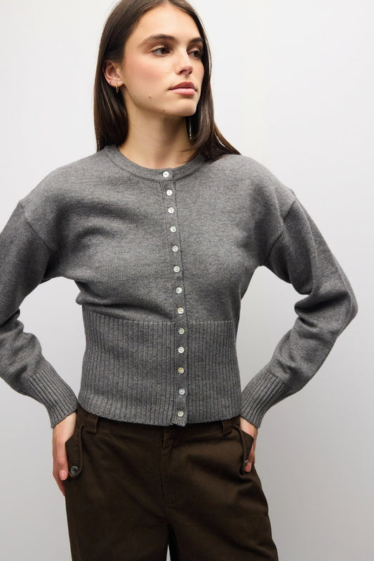 A timeless midweight knit cardigan featuring a polished crew neckline, full button front, and a flattering ribbed waist for effortless everyday sophistication.