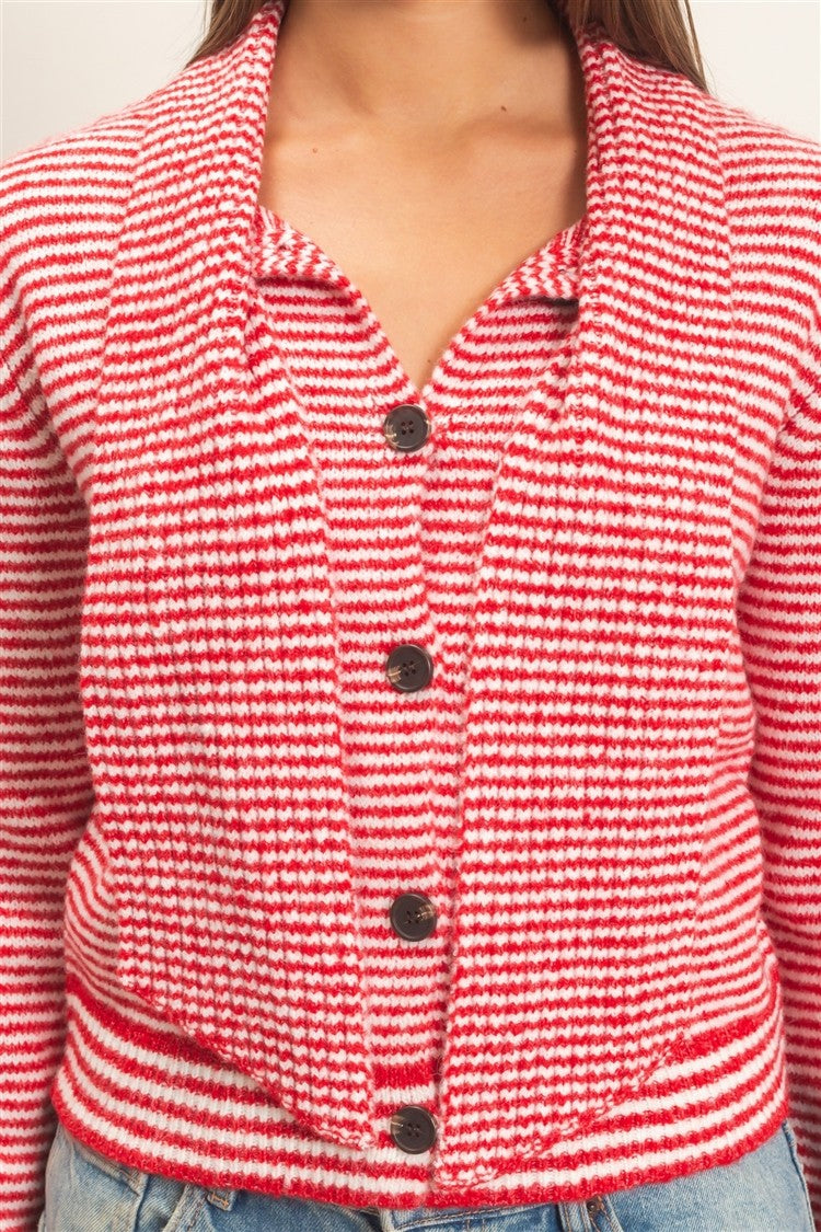 A chic striped knit sweater featuring a full button-up front and attached scarf neckline for a polished, modern layered look.

