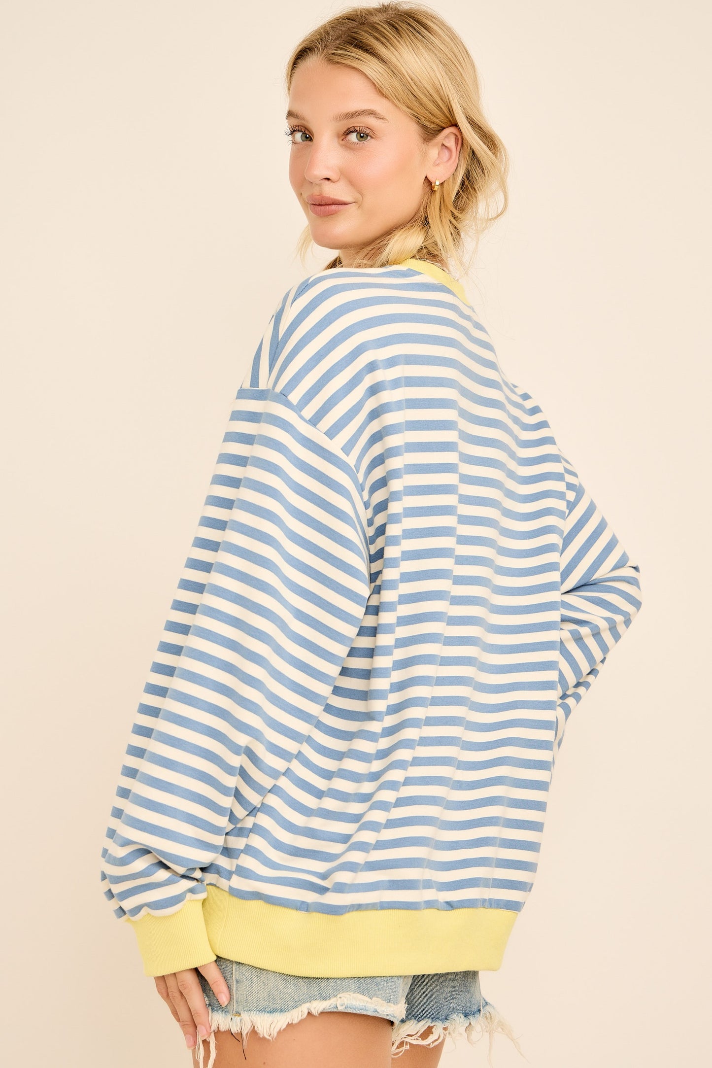 Striped oversized sweatshirt with red crab graphic and ‘OH CRAB’ lettering.