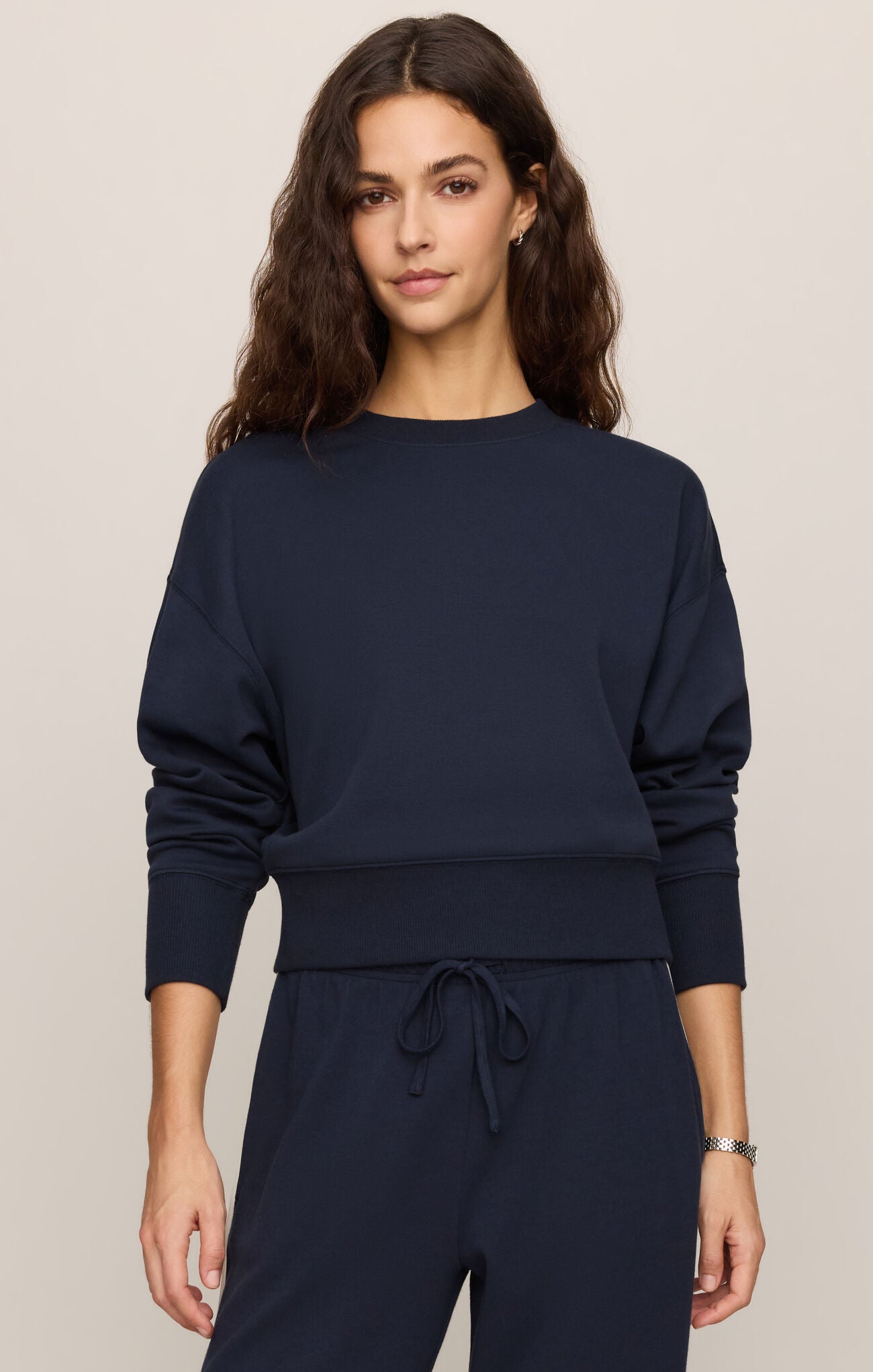 A timeless crewneck sweater crafted from a premium cotton-blend knit, offering effortless sophistication and all-day comfort.