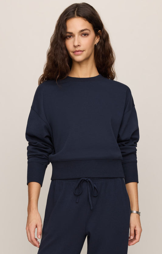 A timeless crewneck sweater crafted from a premium cotton-blend knit, offering effortless sophistication and all-day comfort.