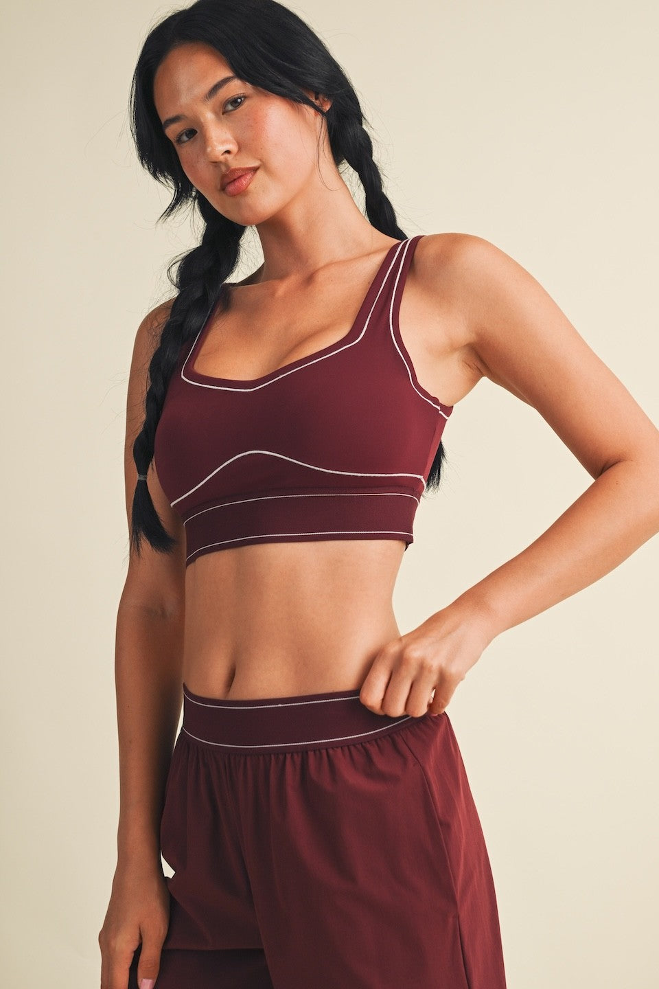 A sleek and supportive performance sports bra featuring eye-catching contrast stitching, breathable stretch, and a smooth, comfortable feel.