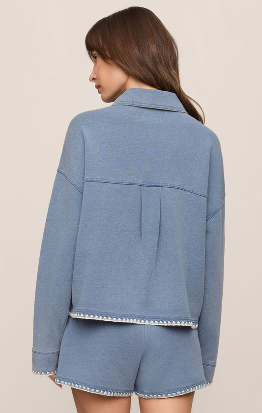 back of cropped denim-inspired jacket crafted from soft French terry knit for comfortable layering with a modern casual feel.