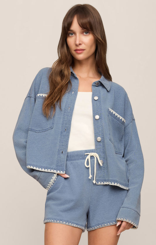 cropped denim-inspired jacket crafted from soft French terry knit for comfortable layering with a modern casual feel.