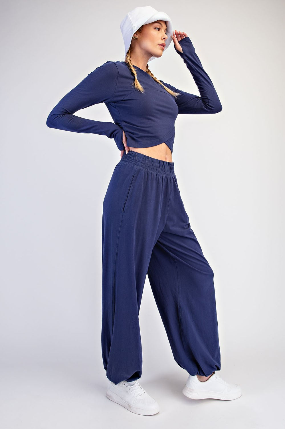 A soft, breathable cotton Lycra two-piece set featuring a cropped long sleeve top and relaxed ankle-length pants for effortless comfort from active days to downtime.

