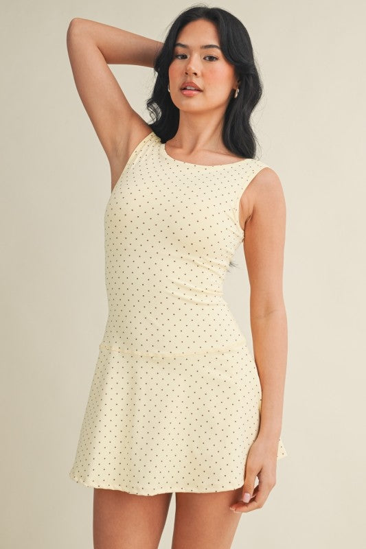 polka dot A-line mini dress with drop waist, soft stretch-knit fabric, and relaxed fit