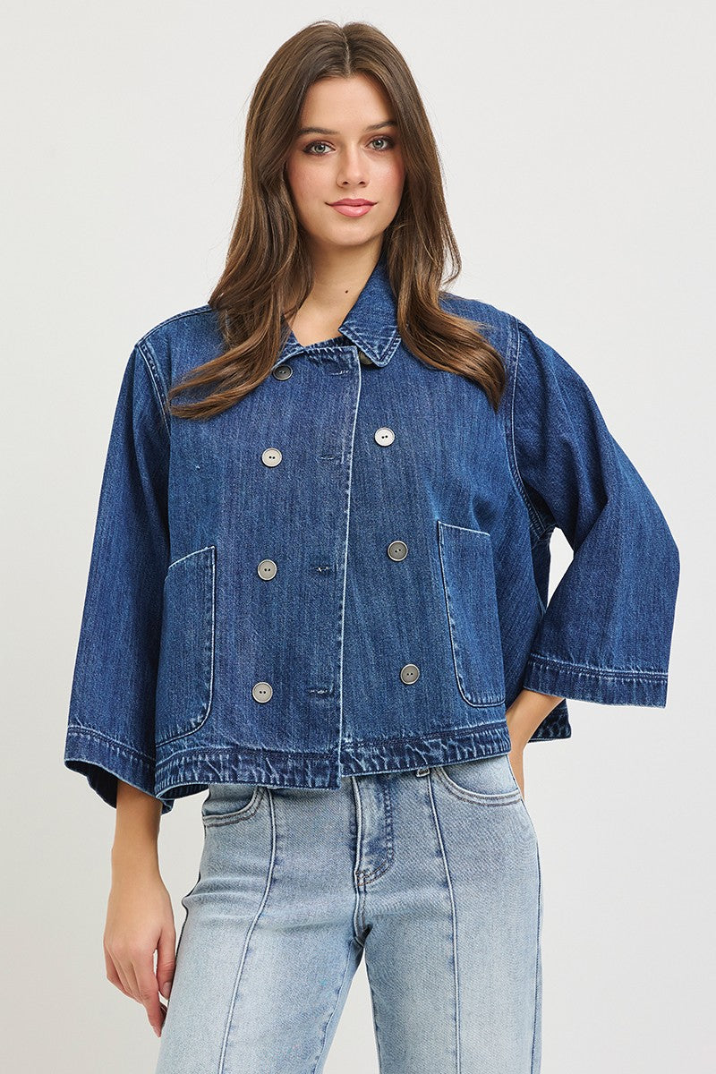The Bernadette Flowy Cropped Denim Jacket gives classic denim a fresh feminine update with a wide, relaxed silhouette, button front, and voluminous sleeves.