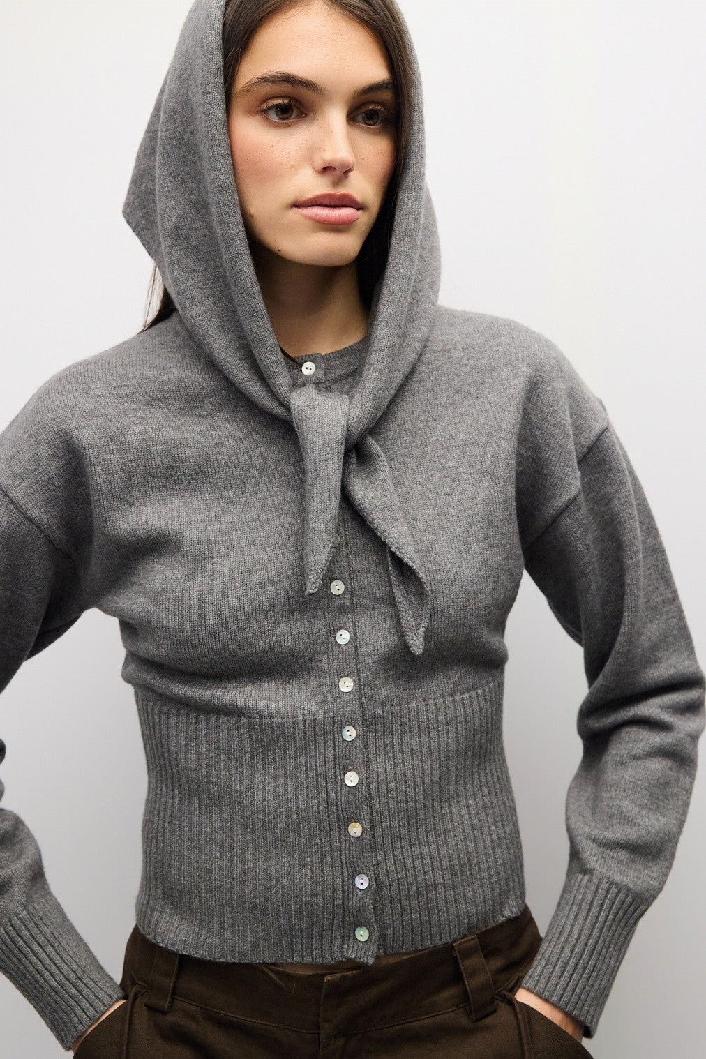 A timeless midweight knit cardigan featuring a polished crew neckline, full button front, and a flattering ribbed waist for effortless everyday sophistication.