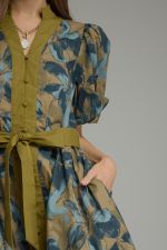 A charming floral mini dress featuring puff sleeves, a button-front design, and a self-tie waist for effortless feminine style.