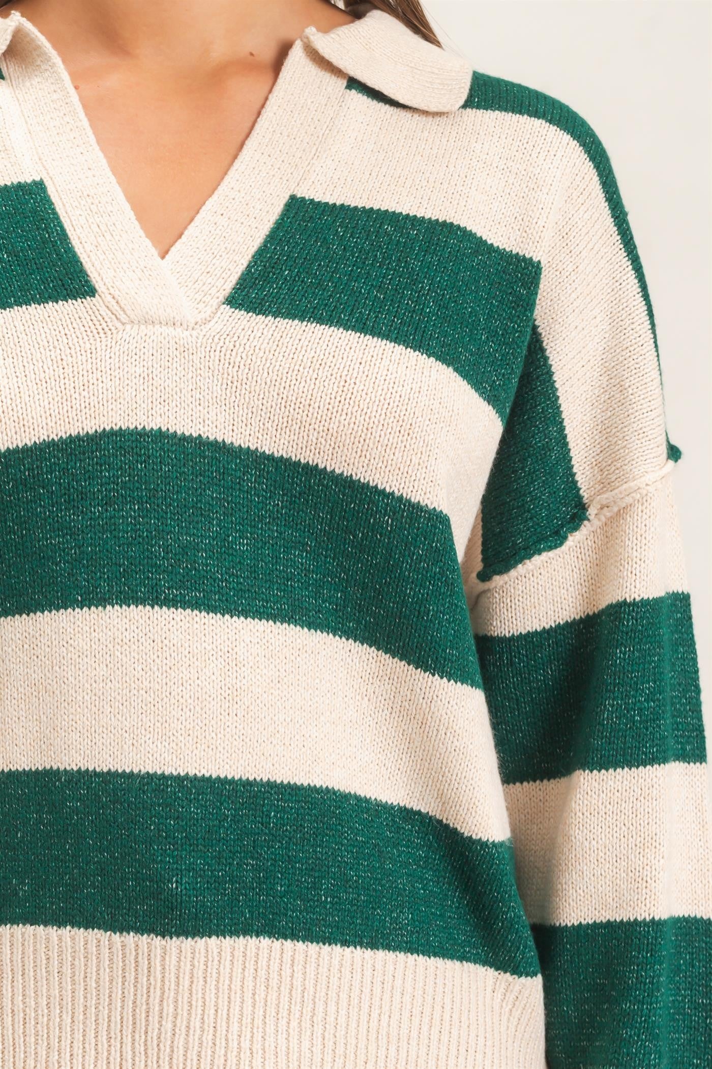 A relaxed striped sweater with a statement wide collar and ribbed cuffs that brings effortless polish to everyday casual style.