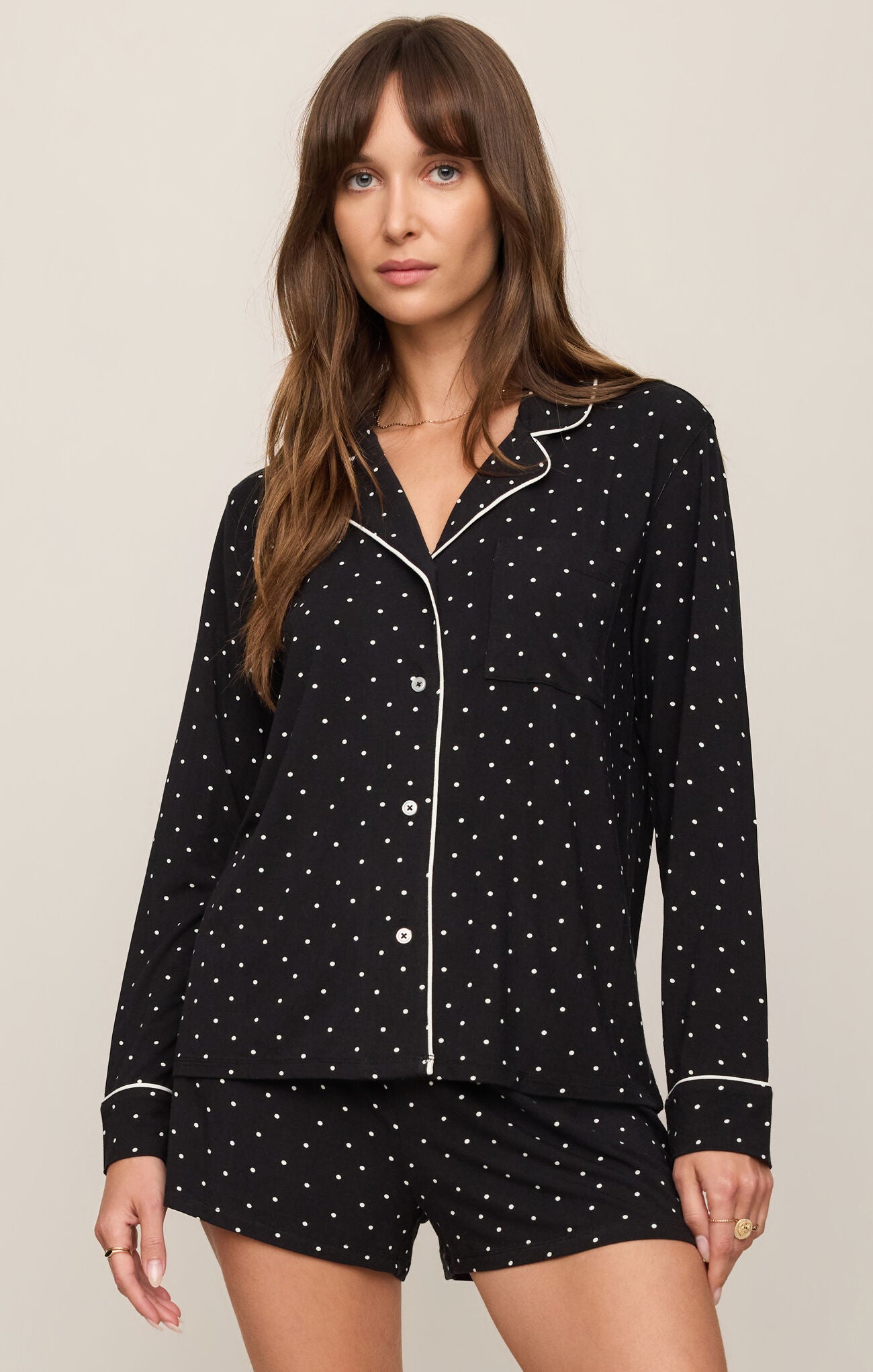Collared Jersey Top combines ultra-soft stretch fabric with a classic button-front design, polished collar, and easy long-sleeve silhouette.