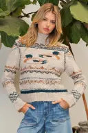 The Dorothy Duck Motif Sweater adds whimsical charm to chilly-day dressing with a cozy mock neckline, playful duck motif, and soft poly-wool blend.
