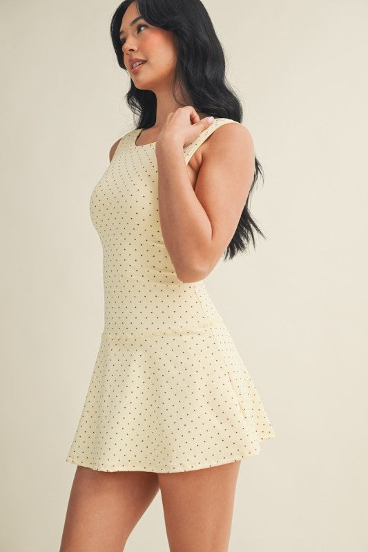 polka dot A-line mini dress with drop waist, soft stretch-knit fabric, and relaxed fit
