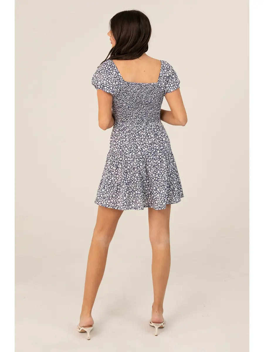 Short-sleeved mini dress with a ditsy floral print and V-neckline