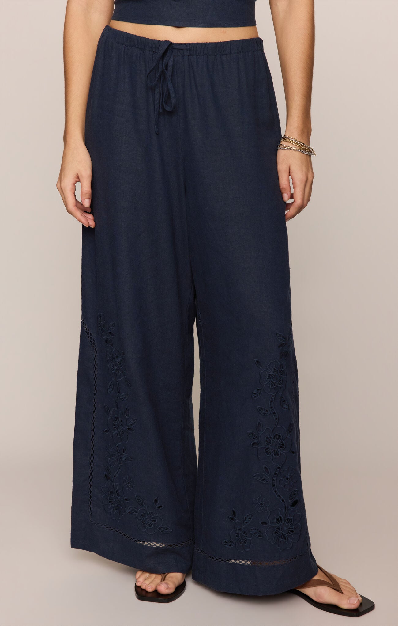 Navy blue wide-leg pants with embroidered trim