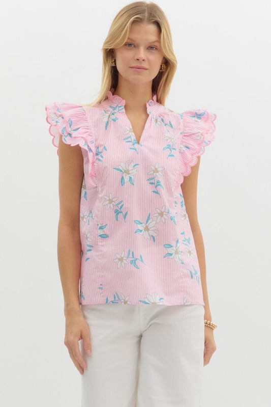 Floral striped pullover top featuring scallop embroidered edge ruffle over shoulder. Scallop edge ruffle band split collar. Unlined. Woven. Non-sheer. Lightweight.
