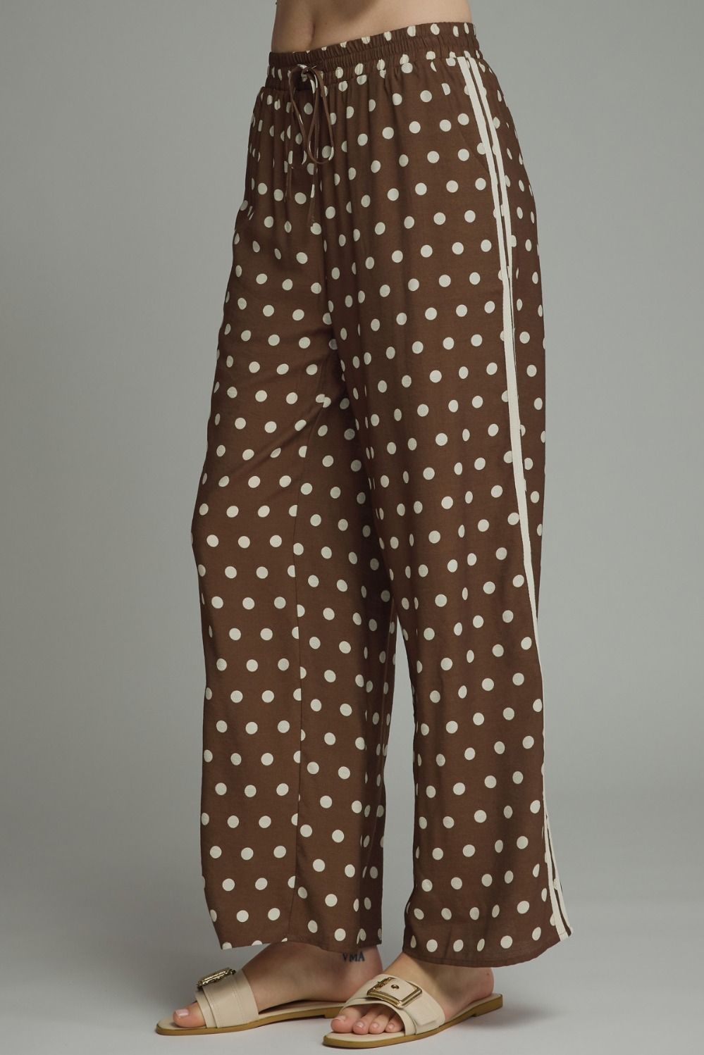 side brown of Playful polka dot pants with a relaxed wide leg silhouette, contrast trim, and an adjustable drawstring waist for effortless everyday style.