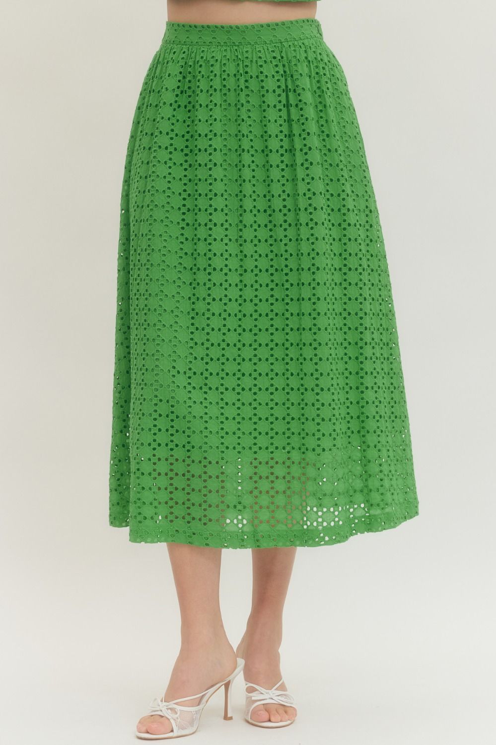cotton midi skirt with eyelet detailing, elastic back waistband, side zipper, and side pocket