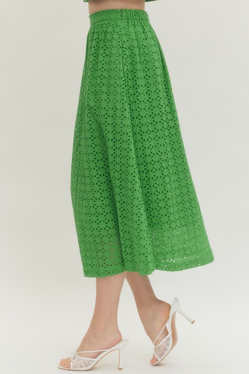cotton midi skirt with eyelet detailing, elastic back waistband, side zipper, and side pocket