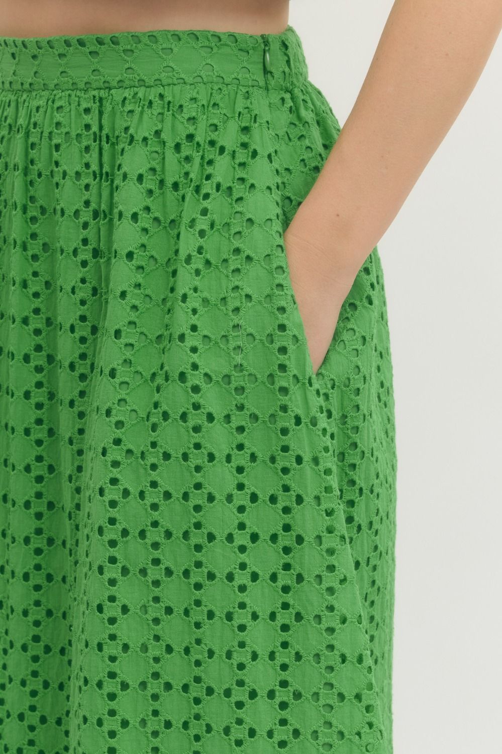 cotton midi skirt with eyelet detailing, elastic back waistband, side zipper, and side pocket