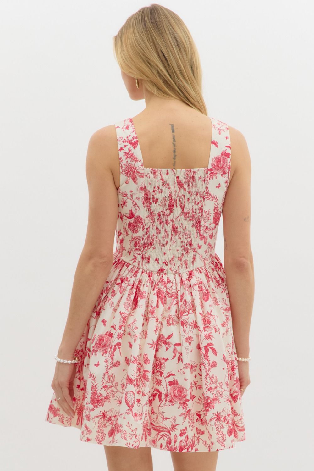 vintage-inspired floral print dress with a fitted bodice and flared skirt.