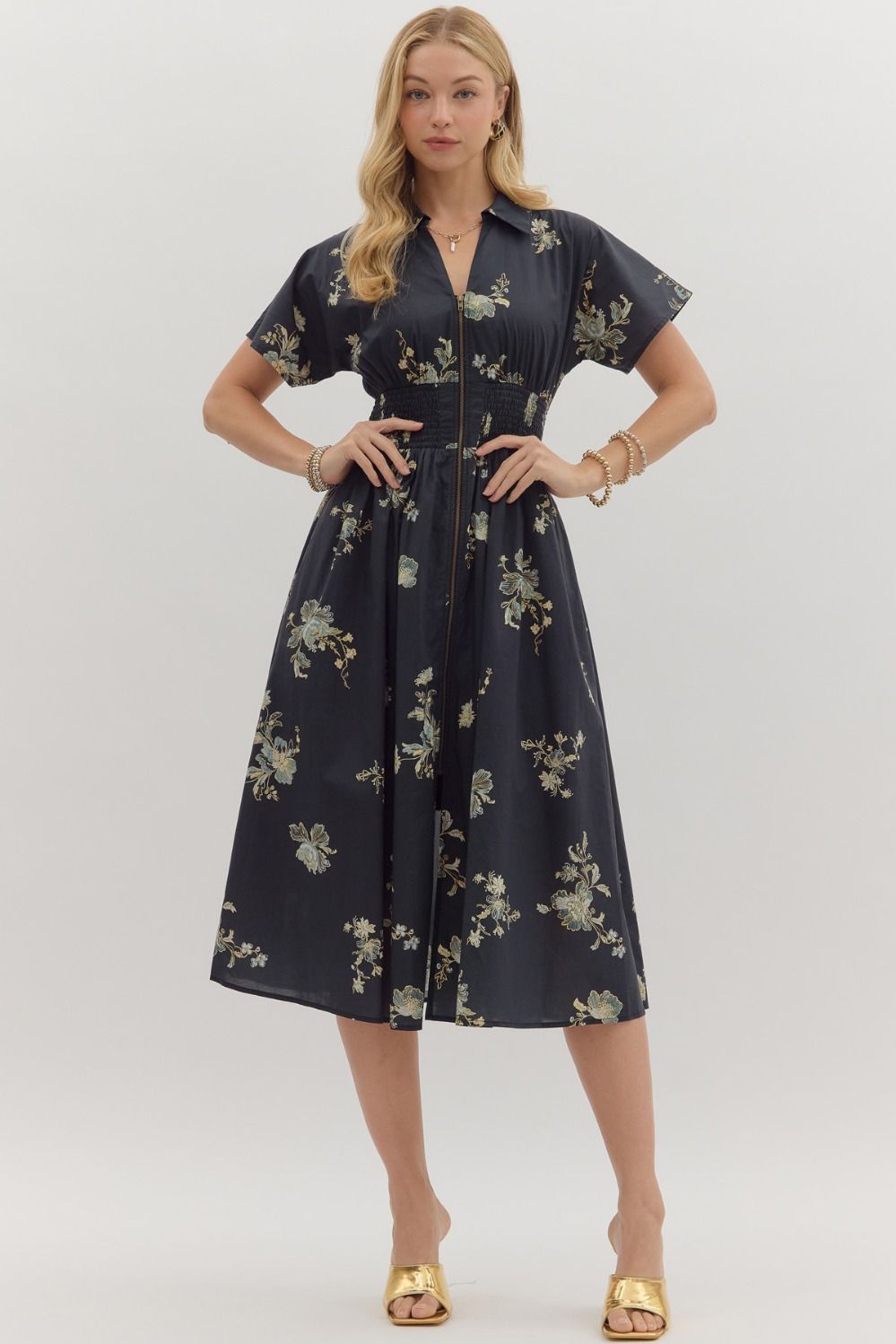 Playful yet polished, the Sylvie mini dress pairs a smocked waist with a bold paisley print for effortless everyday charm.
