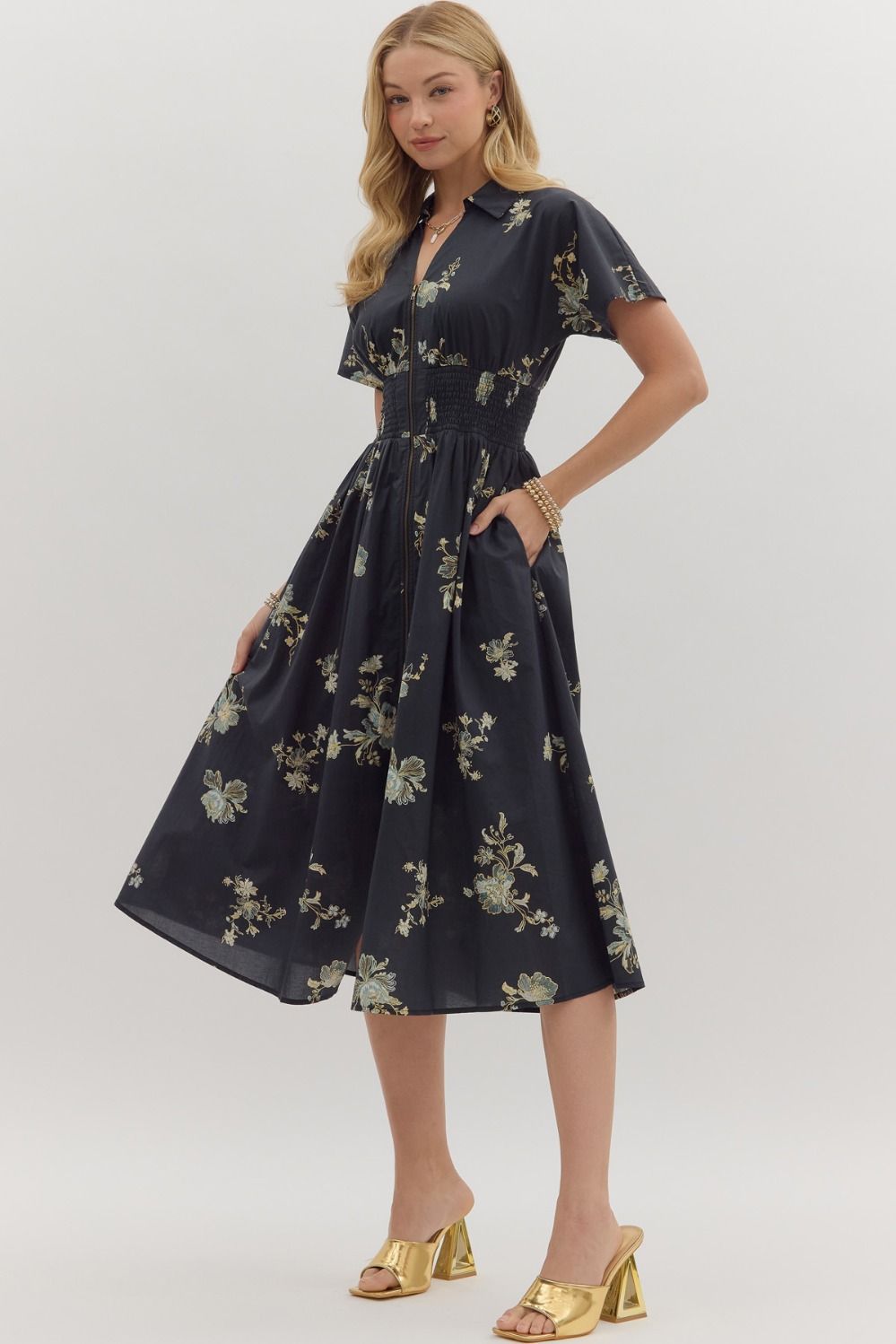 Playful yet polished, the Sylvie mini dress pairs a smocked waist with a bold paisley print for effortless everyday charm.
