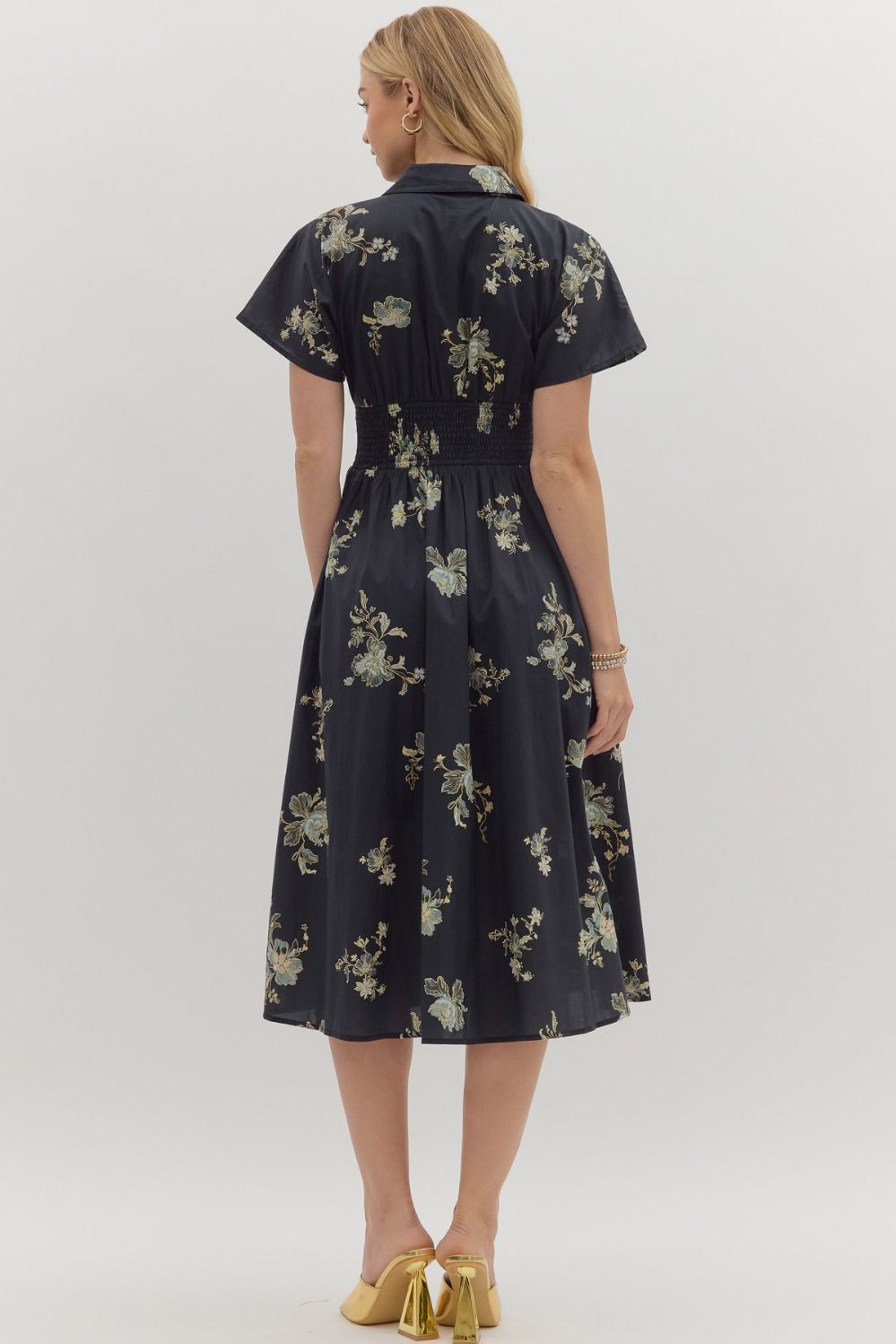 Playful yet polished, the Sylvie mini dress pairs a smocked waist with a bold paisley print for effortless everyday charm.
