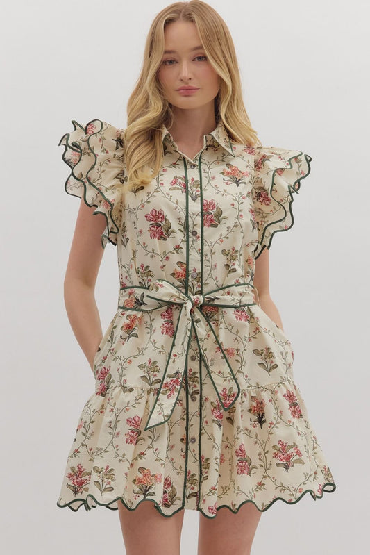 Feminine and polished, the Mabel mini dress pairs flutter sleeves and a tiered skirt with crisp piping and a waist-defining tie.
