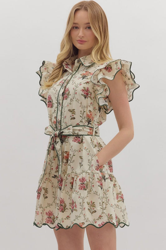 Feminine and polished, the Mabel mini dress pairs flutter sleeves and a tiered skirt with crisp piping and a waist-defining tie.