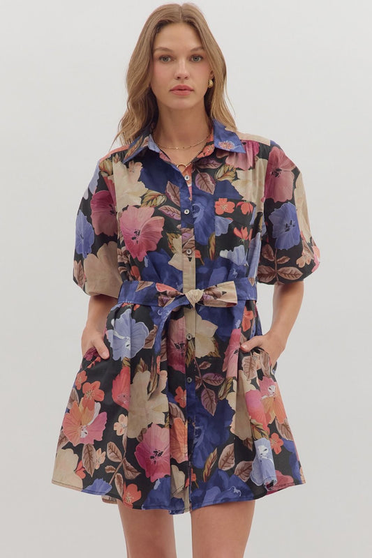 Feminine and functional, the Elowen mini dress features puff sleeves, a self-tie waist, and pockets for effortless charm.