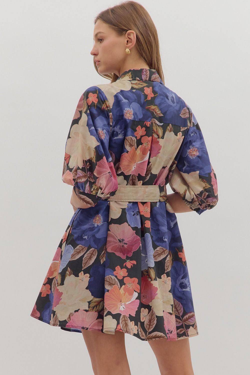 Feminine and functional, the Elowen mini dress features puff sleeves, a self-tie waist, and pockets for effortless charm.